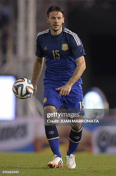 Argentina's defender Martin Demichelis controls the ball during a friendly football match against Trinidad and Tobago at the Monumental stadium in...