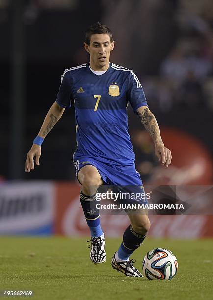 Argentina's midfielder Angel Di Maria controls the ball during a friendly football match against Trinidad and Tobago at the Monumental stadium in...