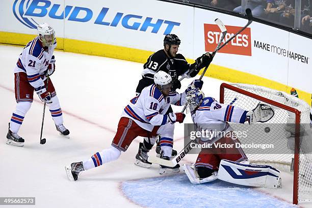 Kyle Clifford of the Los Angeles Kings scores a first period past goaltender Henrik Lundqvist of the New York Rangers during Game One of the 2014 NHL...