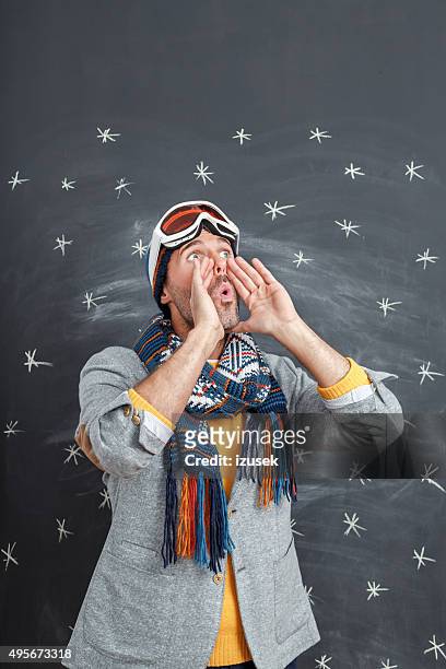 shouting man in winter outfit against blackboard - whistle blackboard stock pictures, royalty-free photos & images