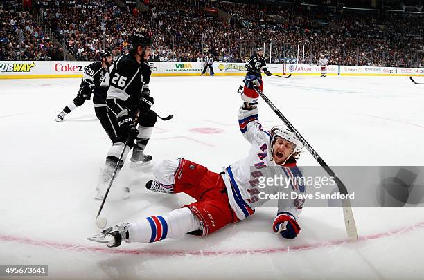 Carl Hagelin of the New York Rangers falss to the ice in the second period of Game One of the 2014 Stanley Cup Final against the Los Angeles Kings at...