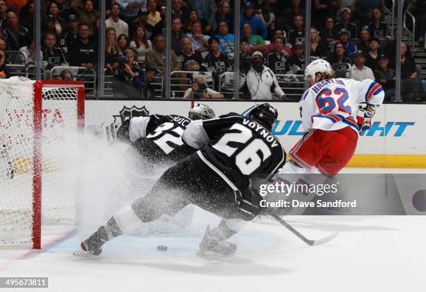 Carl Hagelin of the New York Rangers scores a goal on goaltender Jonathan Quick of the Los Angeles Kings in the first period of Game One of the 2014...