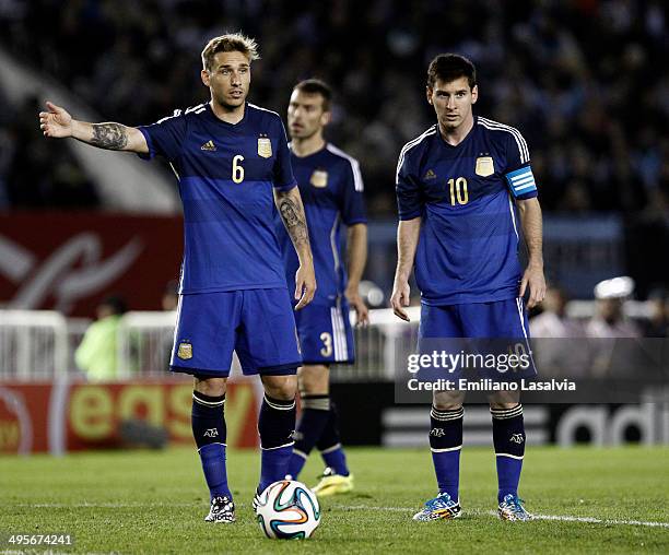 Lucas Biglia, Hugo Campagnaro and Lionel Messi of Argentina during a FIFA friendly match between Argentina and Trinidad & Tobago at Monumental...