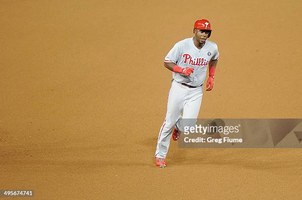 John Mayberry Jr. #15 of the Philadelphia Phillies rounds the bases after hitting a home run in the seventh inning against the Washington Nationals...