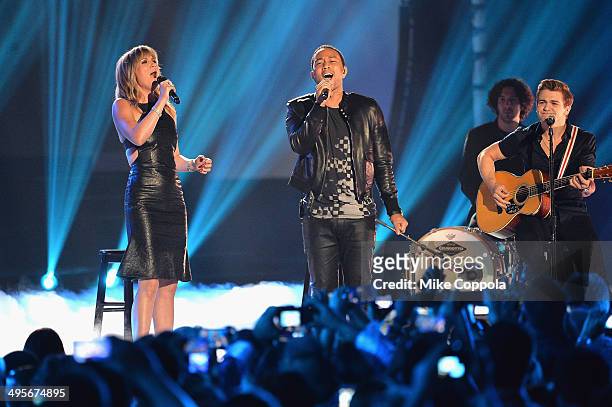 Jennifer Nettles, John Legend and Hunter Hayes perform onstage during the 2014 CMT Music awards at the Bridgestone Arena on June 4, 2014 in...