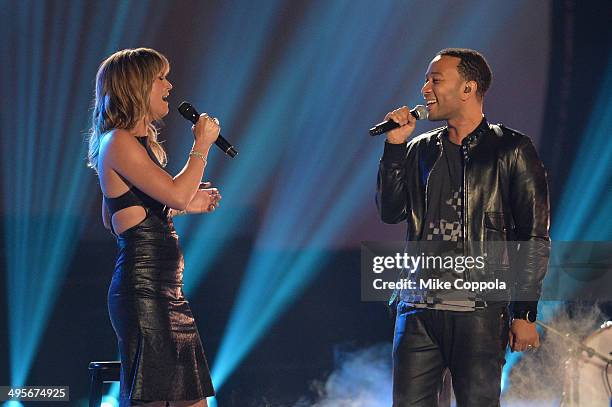 Jennifer Nettles and John Legend perform onstage during the 2014 CMT Music awards at the Bridgestone Arena on June 4, 2014 in Nashville, Tennessee.