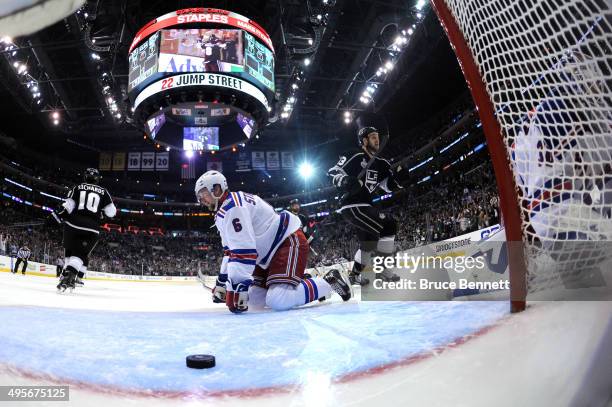Anton Stralman of the New York Rangers sits on the ice after the Rangers allow a goal to Drew Doughty of the Los Angeles Kings as teammate Kyle...