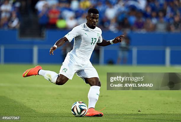 Ivory Coast's defender Serge Aurier kicks the ball during a World Cup preparation match between Ivory Coast and El Salvador at the Toyota Stadium in...