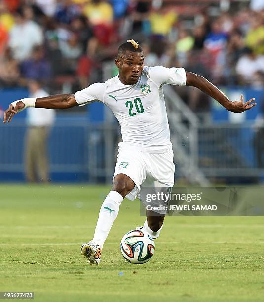Ivory Coast's midfielder Die Geoffroy Serey runs with the ball during a World Cup preparation match between Ivory Coast and El Salvador at the Toyota...