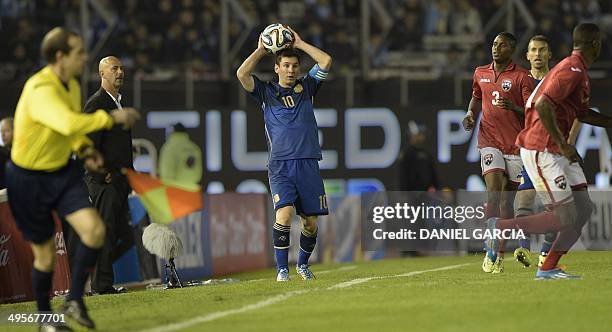 Argentina's forward Lionel Messi serves the ball during a friendly match against Trinidad and Tobago at the Monumental stadium in Buenos Aires,...