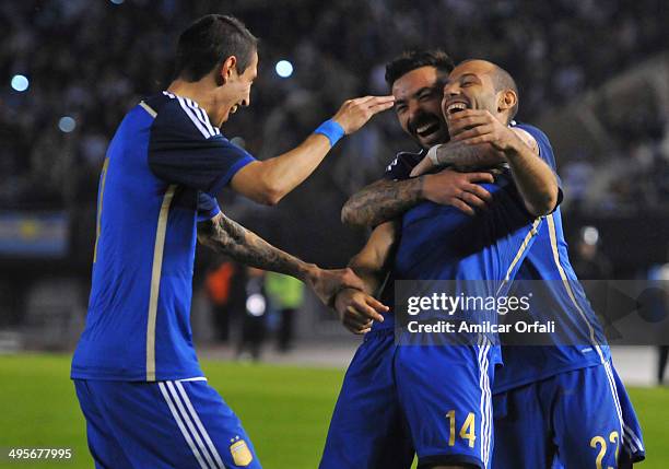 Javier Mascherano of Argentina celebrates the second goal of his team with teammates during a FIFA friendly match between Argentina and Trinidad &...