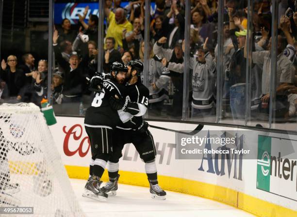 Drew Doughty of the Los Angeles Kings celebrates his goal with teammate Kyle Clifford against the New York Rangers in the second period of Game One...