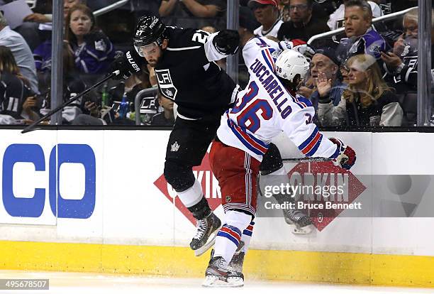 Alec Martinez of the Los Angeles Kings checks Mats Zuccarello of the New York Rangers in the second period during Game One of the 2014 NHL Stanley...