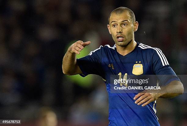 Argentina's midfielder Javier Mascherano gives instructions to teammates during a friendly match against Trinidad and Tobago at the Monumental...