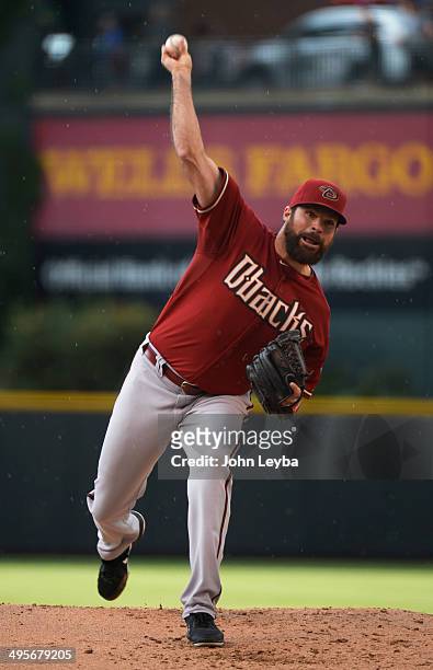 Arizona Diamondbacks starting pitcher Josh Collmenter delivers a pitch during the first inning against the Colorado Rockies June 4, 2014 at Coors...