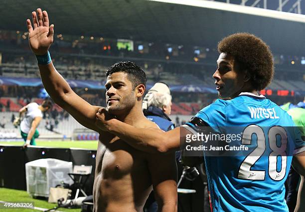 Hulk and Axel Witsel of FC Zenit celebrate the victory and the qualification following the UEFA Champions league match between Olympique Lyonnais and...