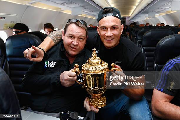 All Black coach Steve (L and Sonny Bill Williams pose with the Webb Ellis Cup enroute to Christchurch for the New Zealand All Blacks welcome home...