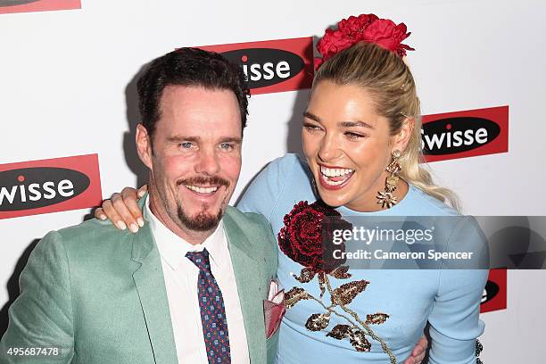 Ashley Hart poses with actor Kevin Dillon at the Swisse Marquee on Oaks Day at Flemington Racecourse on November 5, 2015 in Melbourne, Australia.