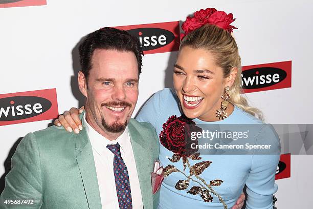 Ashley Hart poses with actor Kevin Dillon at the Swisse Marquee on Oaks Day at Flemington Racecourse on November 5, 2015 in Melbourne, Australia.