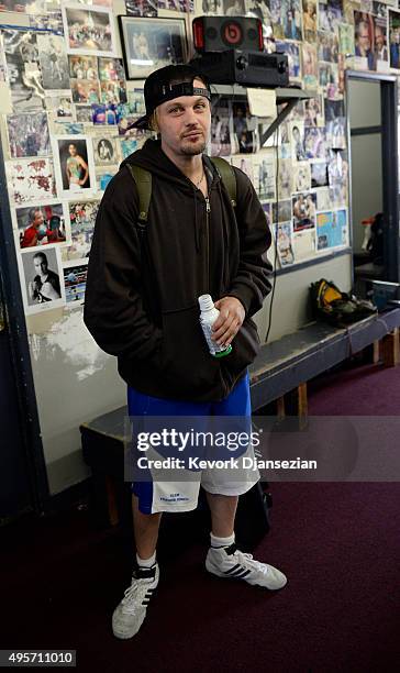 Actor Michael Pitt, who trains at Wild Card Boxing Club, looks on as boxer Miguel Cotto holds a media workout at Wild Card Boxing Club November 4 in...