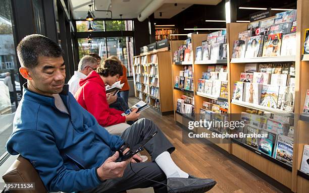 Jeff Ing of Seattle uses a Kindle Fire tablet device at the newly opened Amazon Books store on November 4, 2015 in Seattle, Washington. The online...