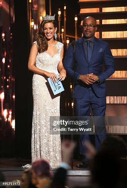 Presenters Miss America 2016, Betty Cantrell, and recording artist Darius Rucker speak onstage at the 49th annual CMA Awards at the Bridgestone Arena...