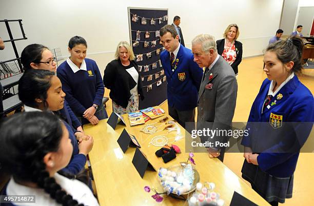 Prince Charles, Prince of Wales meets with pupils hwo manufacture small goods as part of a business course at Tawa College on November 5, 2015 in...