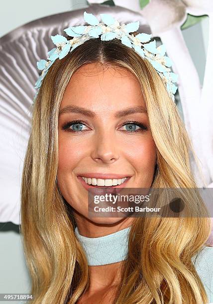 Jennifer Hawkins wearing Daniel Avakian and millinery by Viktoria Novak poses at the Myer Marquee on Oaks Day at Flemington Racecourse on November 5,...