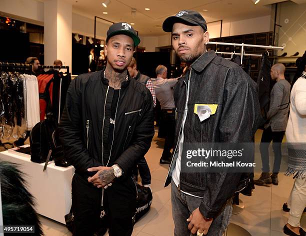 Rapper Tyga and recording artist Chris Brown attend the Balmain x H&M Los Angeles VIP Pre-Launch on November 4, 2015 in West Hollywood, California.