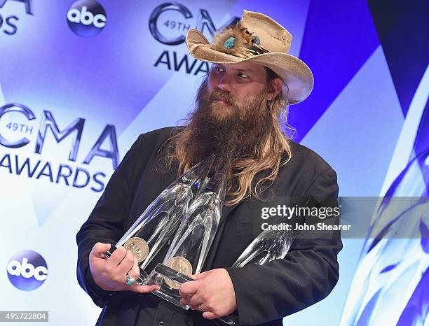 Singer-songwriter Chris Stapleton poses with his Album of the Year, New Artist of the Year, and Male Vocalist of the Year awards in the pressr room...