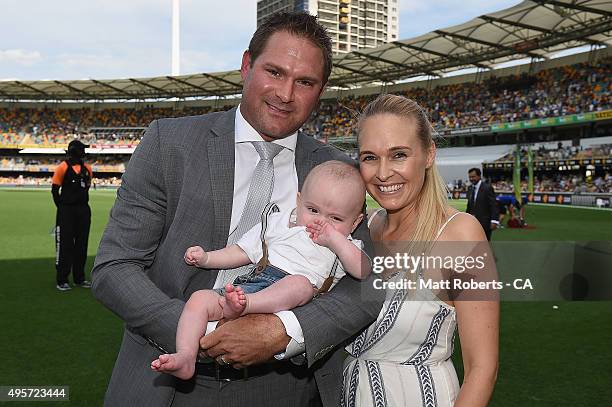 Ryan Harris poses with his wife Cherie and son Carter during day one of the First Test match between Australia and New Zealand at The Gabba on...