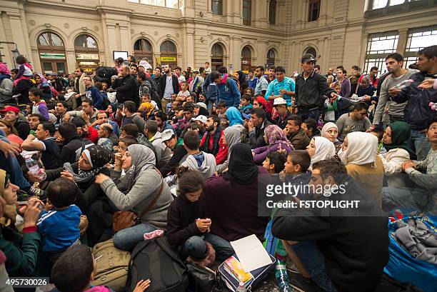 refugee in train station - 2015 stock pictures, royalty-free photos & images