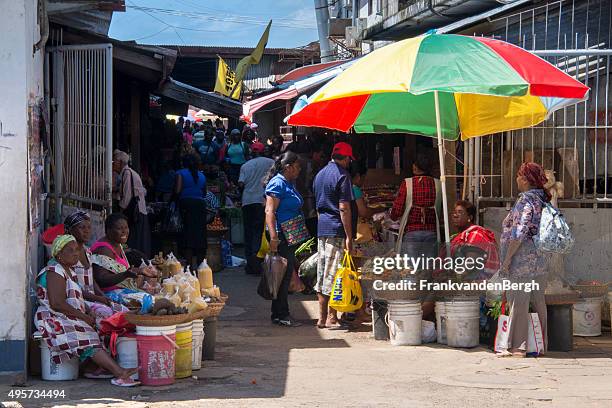 street vendors and shoppers at the main market in paramaribo - gazon stock pictures, royalty-free photos & images