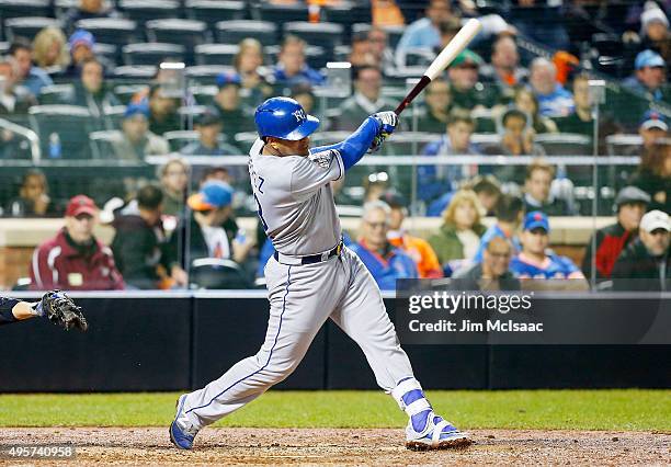Salvador Perez of the Kansas City Royals follows through on a 12th inning base hit against the New York Mets during game five of the 2015 World...