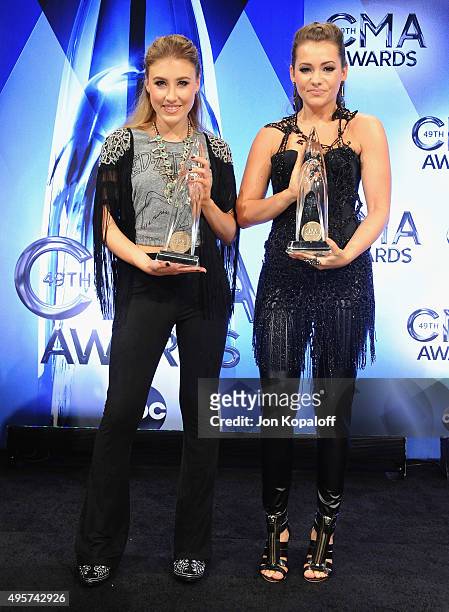 Maddie Marlow and Tae Dye of Maddie & Tae pose in the press room at the 49th annual CMA Awards at the Bridgestone Arena on November 4, 2015 in...