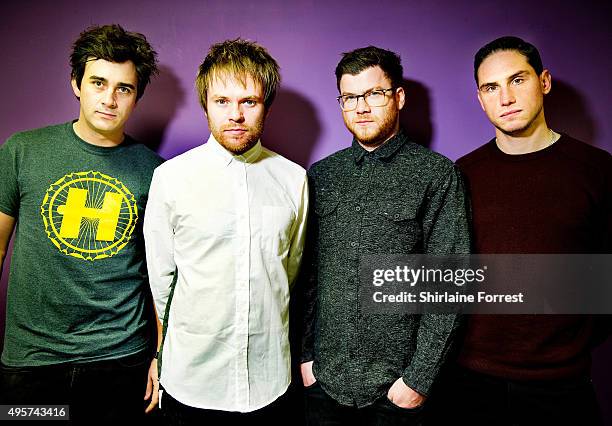 Chris Batten, Rou Reynolds, Rory Clewlow and Rob Rolfe of Enter Shikari pose backstage before meeting fans and signing copies of their new album 'The...