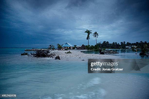 The small village Eita has become a separate island during high tide. The people of Kiribati are under pressure to relocate due to sea level rise....