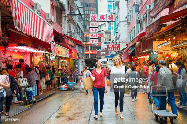 young woman shopping in hong kong - tourist market stock pictures, royalty-free photos & images