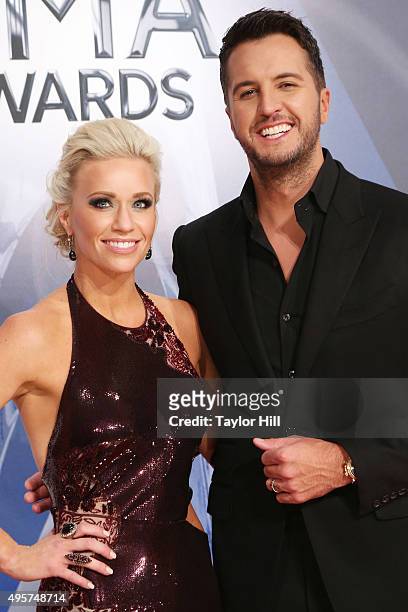 Caroline Boyer and Luke Bryan attend the 49th annual CMA Awards at the Bridgestone Arena on November 4, 2015 in Nashville, Tennessee.