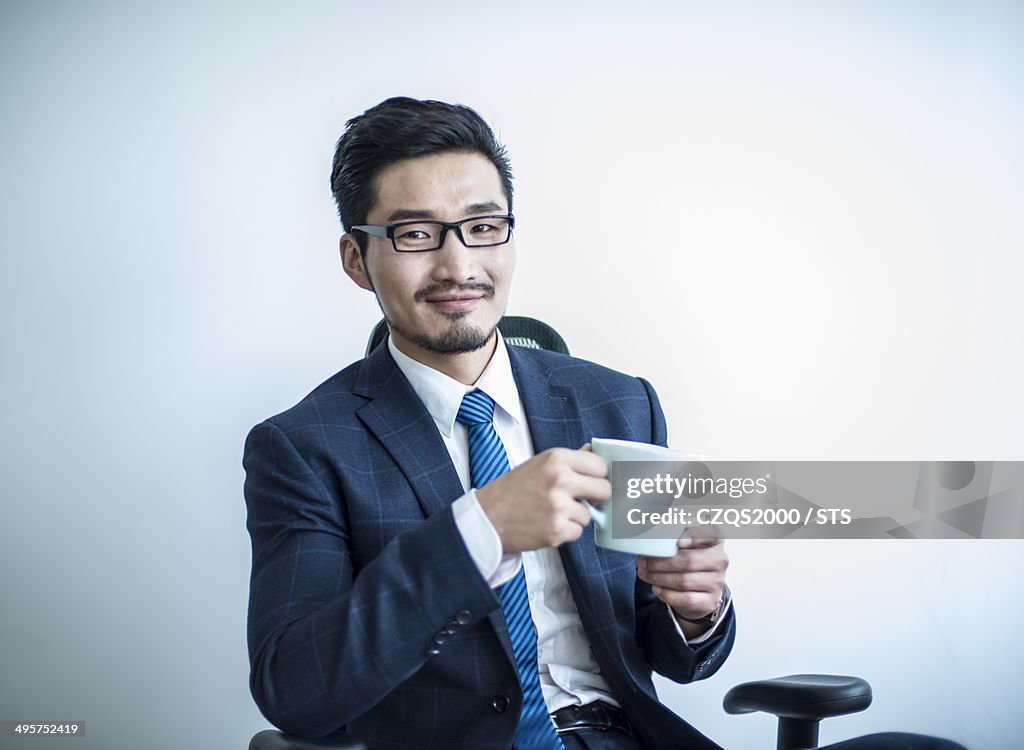 Businessman seated in office