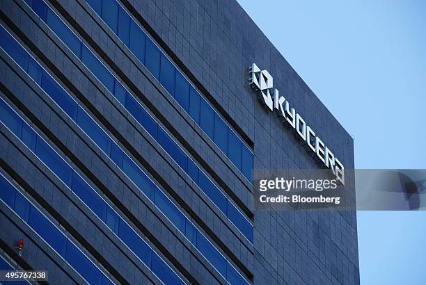 The Kyocera Corp. Logo is displayed at the company's headquarters in Kyoto, Japan, on Friday, Oct. 23, 2015. Billionaire Kazuo Inamori established...