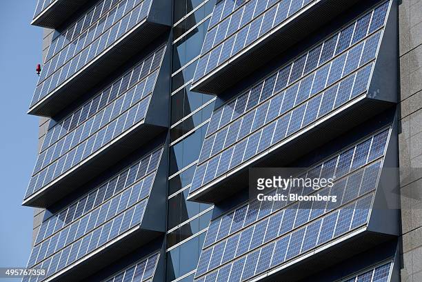 Solar panels are mounted on the exterior of the Kyocera Corp. Headquarters in Kyoto, Japan, on Friday, Oct. 23, 2015. Billionaire Kazuo Inamori...