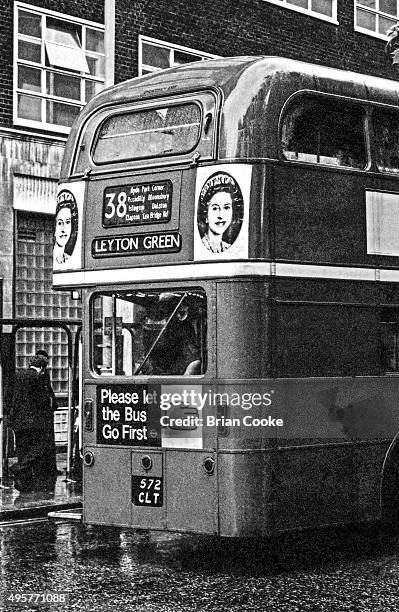 London bus in Charing Cross Road, central London, June 1977, carrying posters for the English punk rock band the Sex Pistols' single 'God Save The...