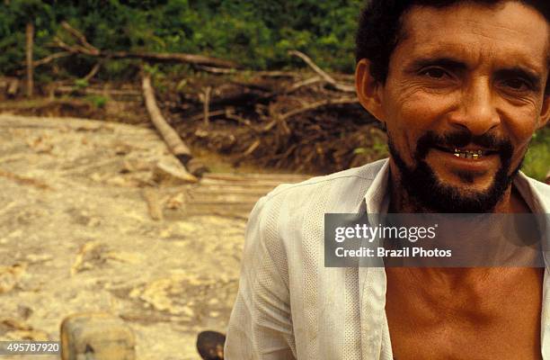 Amazon deforestation and pollution left behind by independent gold miners - golden teeth. Roraima State, Brazil.