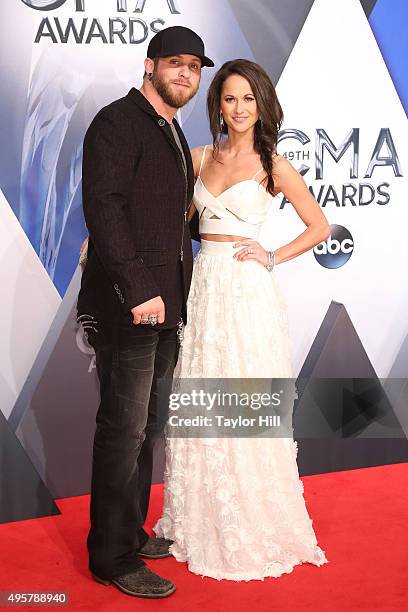 Musical artist Brantley Gilbert and Amber Cochran attend the 49th annual CMA Awards at the Bridgestone Arena on November 4, 2015 in Nashville,...