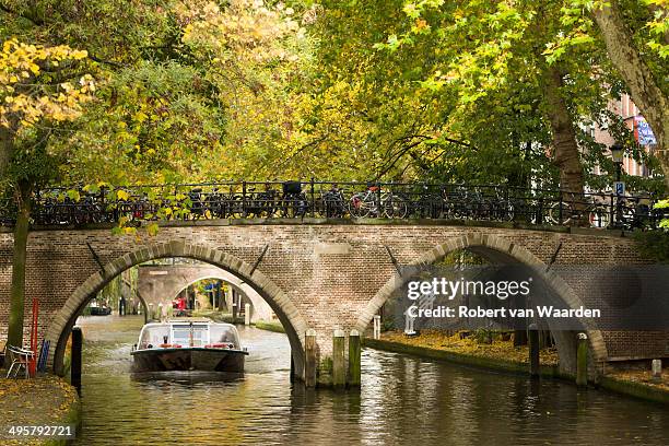 a canal boat on the singel canal of utrecht, the netherlands. - utrecht fotografías e imágenes de stock