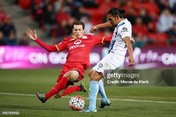 David Williams of Melbourne City competes with Craig Goodwin of Adelaide United during the round five A-League match between Adelaide United and...