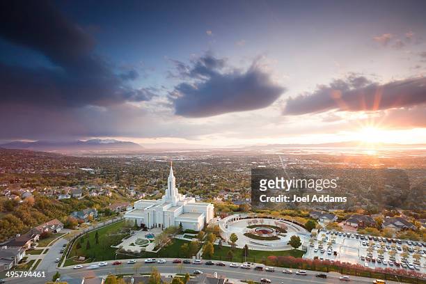 the mormon (lds) temple in bountiful utah sits above the great salt lake at dusk. - salt lake city stock pictures, royalty-free photos & images