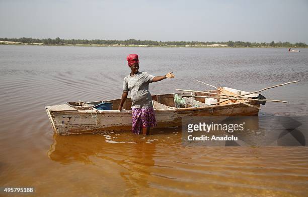 An African woman is seen during the process of taking salt out of the Lake Retba, 40 kilometers away from Dakar in Senegal, on November 5, 2015. Lake...