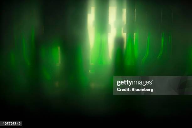 Bottles of Beck's lager are filled with beer on the production line at the Beck's brewery, operated by Anheuser-Busch InBev NV, in Bremen, Germany,...